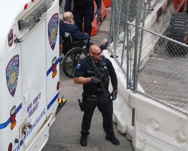 Harvey Weinstein leaving Bellevue Hospital in New York, accompanied by armed NYCD ESU officers, heading towards court